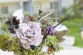 Bouquet has Christmas tree branches and artificial flowers. Royalty Free Stock Photo