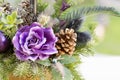 Bouquet has Christmas tree branches and artificial flowers. Royalty Free Stock Photo