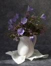 Bouquet of heather with bluebells in a white jug Royalty Free Stock Photo