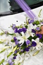 Bouquet on the hood of the wedding car Royalty Free Stock Photo