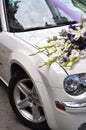 Bouquet on the hood of the wedding car Royalty Free Stock Photo