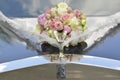 Bouquet on the hood of the wedding car Royalty Free Stock Photo