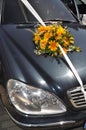 Bouquet on the hood of the wedding car Royalty Free Stock Photo