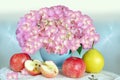 A bouquet of hydrangeas and fresh ripe fruit, on the table. Beautiful fractal background, selective focus