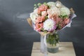 Bouquet in kraft paper. A simple bouquet of flowers and greens Royalty Free Stock Photo