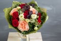 Bouquet in kraft paper. A simple bouquet of flowers and greens Royalty Free Stock Photo