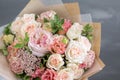 Bouquet in kraft paper. A simple bouquet of flowers and greens Royalty Free Stock Photo