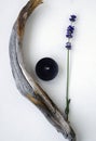 Bouquet of lavender flowers, a candle, and a wooden stick Royalty Free Stock Photo