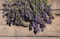 Bouquet of lavender flowers on a wooden background. Lots of fragrant summer flowers. Copy space Royalty Free Stock Photo