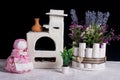 A bouquet of lavender and an oberezhnitsa doll. antique white stove,