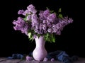 Bouquet of lilac in vase and blue fabric isolated on black Royalty Free Stock Photo