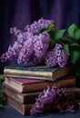 bouquet of lilacs and old books, on a table in the garden in the shade of trees Royalty Free Stock Photo