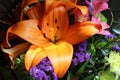 A bouquet of lilies and other flowers artistically arranged for a special occasion.