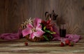 Bouquet of lilies, wine and strawberries close-up Royalty Free Stock Photo