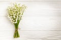 Bouquet of lily of the valley flowers on wooden background with copy space: spring time concept Royalty Free Stock Photo