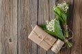 Bouquet lily of the valley on natural wooden background