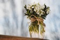 A bouquet of little fresh snowdrops in a glass vase outdoors. Bunch of flowers. Galanthus nivalis Royalty Free Stock Photo