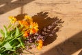 Bouquet of marigold flowers on wood table