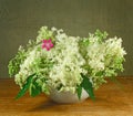 Bouquet of meadow flowers on a wooden table Royalty Free Stock Photo