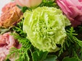 Bouquet of mixed flowers on wood background, Roses, Carnation, Eustoma, dry flowers