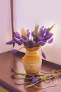 Bouquet of muscari flowers in a vintage vase on the window. Romantic spring flowers on the windowsill. Royalty Free Stock Photo