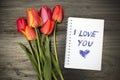 Bouquet and notepad with words `I love you` Royalty Free Stock Photo