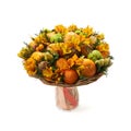 Bouquet of orange flowers, oranges, tangerines and cones on a white background