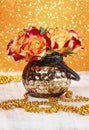 Bouquet of orange and red roses in golden vase Royalty Free Stock Photo