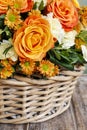 Bouquet of orange roses and ivory carnation flowers Royalty Free Stock Photo