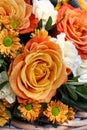 Bouquet of orange roses and white carnation flowers Royalty Free Stock Photo