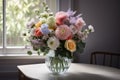 a bouquet of pastel flowers in a clear vase