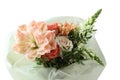 A bouquet of peach daylilies, orange and pink roses and beige chrysanthemums. Closeup