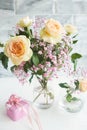 Bouquet of peach spray roses and gypsophila and pink gift box