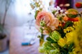 Bouquet of peony roses and tulips on the table in a vase Royalty Free Stock Photo