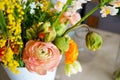 Bouquet of peony roses and tulips on the table in a vase Royalty Free Stock Photo