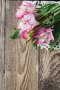 Bouquet of pink flowers of Alstroemeria on wooden background