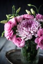 Bouquet of pink flowers in vase vintage decor Royalty Free Stock Photo