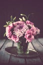 Bouquet of pink flowers in vase vintage decor Royalty Free Stock Photo