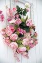 Bouquet of pink orchids, roses and peons in a large frame hanging on the wall Royalty Free Stock Photo