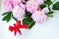 A Bouquet Of Pink Peonies, A Box With A Gift Tied With A Red Bow On A White Background. Happy Birthday Or Wedding Day Greeting