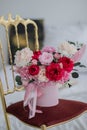 Bouquet of pink peonies a girl for mother's day, valentine's day, Woman's day 8 march. White interior.