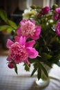 bouquet of pink peonies in a vase on the table Royalty Free Stock Photo