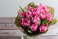 Bouquet of pink peony tulips on a wooden background. Spring flowers. Mother`s Day background. Royalty Free Stock Photo