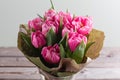 Bouquet of pink peony tulips on a wooden background. Spring flowers. Mother`s Day background. Royalty Free Stock Photo