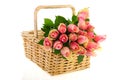 Bouquet pink roses in cane basket Royalty Free Stock Photo