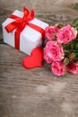Bouquet of pink roses, heart and gift Royalty Free Stock Photo