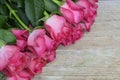 Bouquet of pink roses on old wooden background.Valentine`s Day,Mother`s Day or Birthday gift concept with copy space. Royalty Free Stock Photo