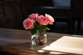 Bouquet of pink roses in a vase on a wooden table Royalty Free Stock Photo