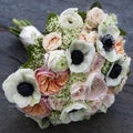 Bouquet of pink roses and white anemone and pink ranunculus