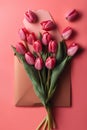 Bouquet of pink tulips in envelope on red background. Royalty Free Stock Photo